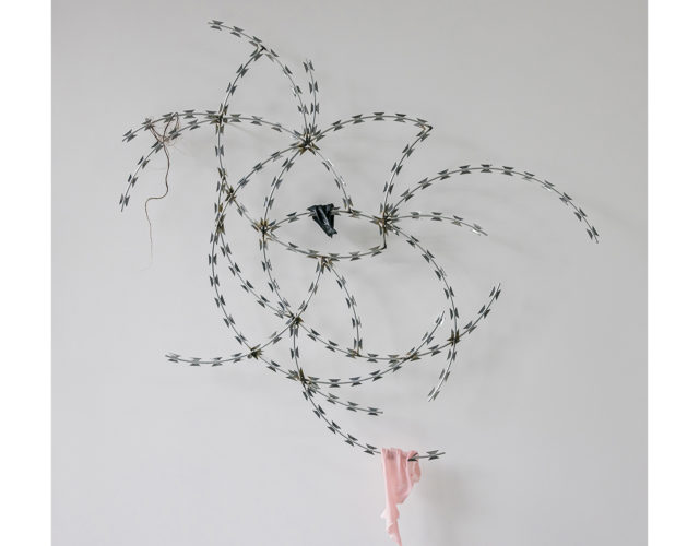 Hao Ni, Small Barrier III, 2020, Razor wire,Textiles, 86x60cm